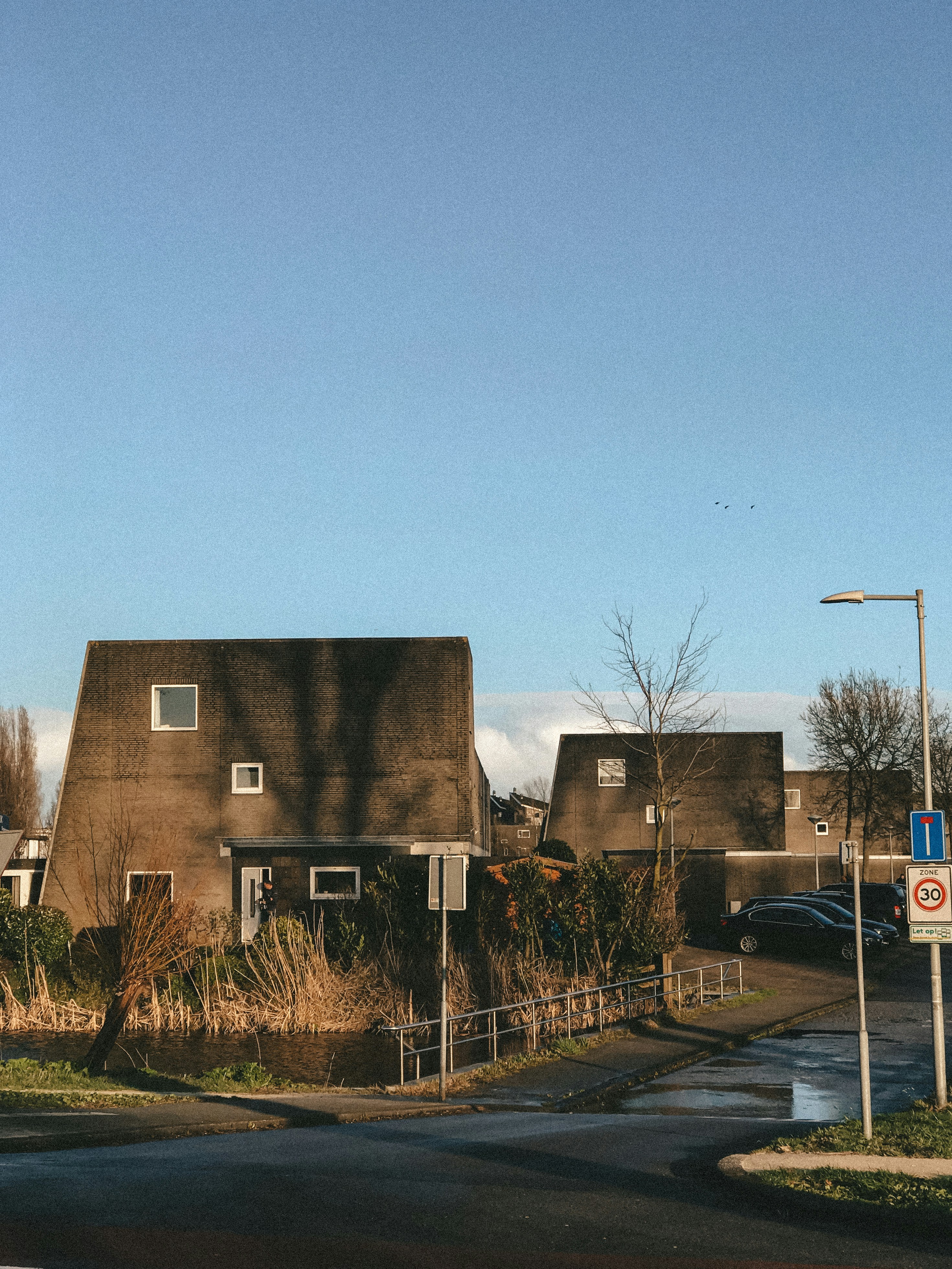 brown concrete building near green grass field during daytime